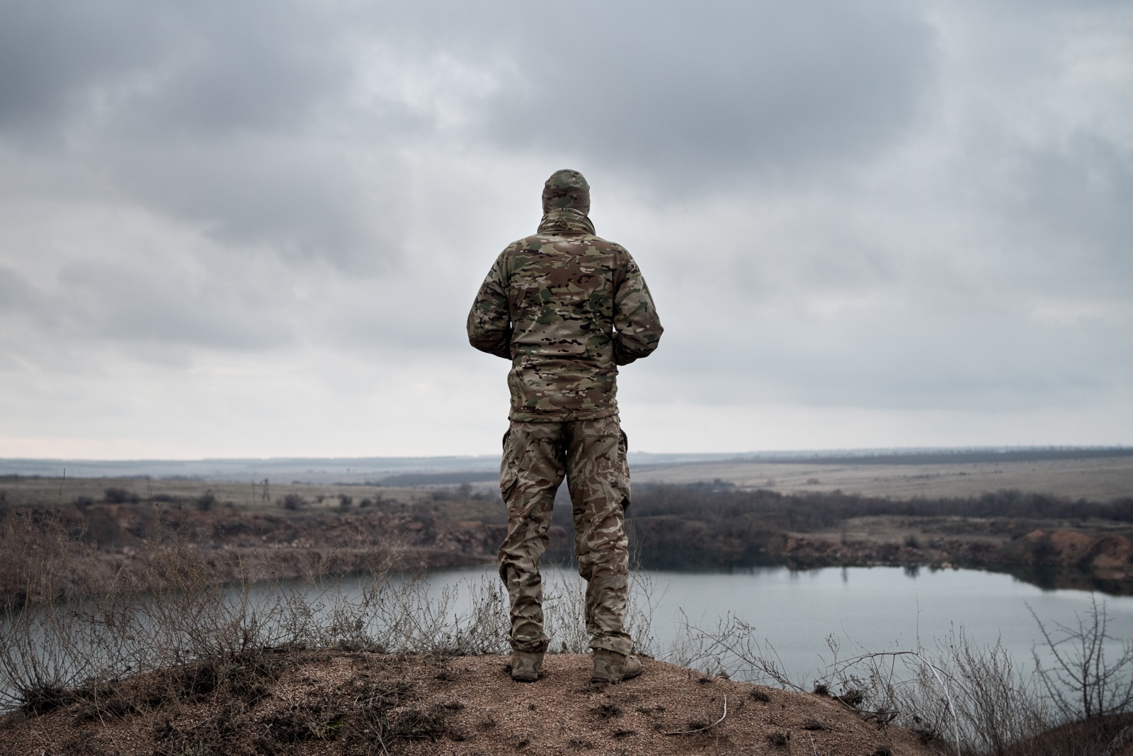OVER THERE - Volnovakha, Donbas (Ukraine) December 15, 2018
A Ukrainian soldier from the 128 Mechanized Brigade observes the areas occupied by the separatists north of Volnovakha, in the Donbas. On the horizon, the southern front line that reaches Shyrokyne, on the Azov Sea. According to observers of the OSCE SMM international mission, heavy weapons prohibited by the Minsk agreements are often used in combat. This area is considered strategic for the conquest of Mariupol, home of the most important steel plants in the country: the occupation of the town, already invaded by the pro-Russians in 2014 and then freed, would allow separatists to create a corridor to connect Lugansk and Donetsk to Crimea, the Ukrainian peninsula which in 2014 declared independence thanks to Russia's political and military support.
